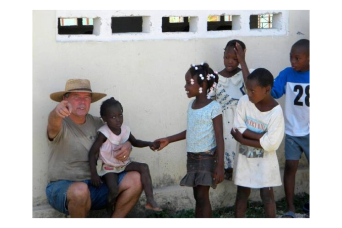 Patrick with children taking a break